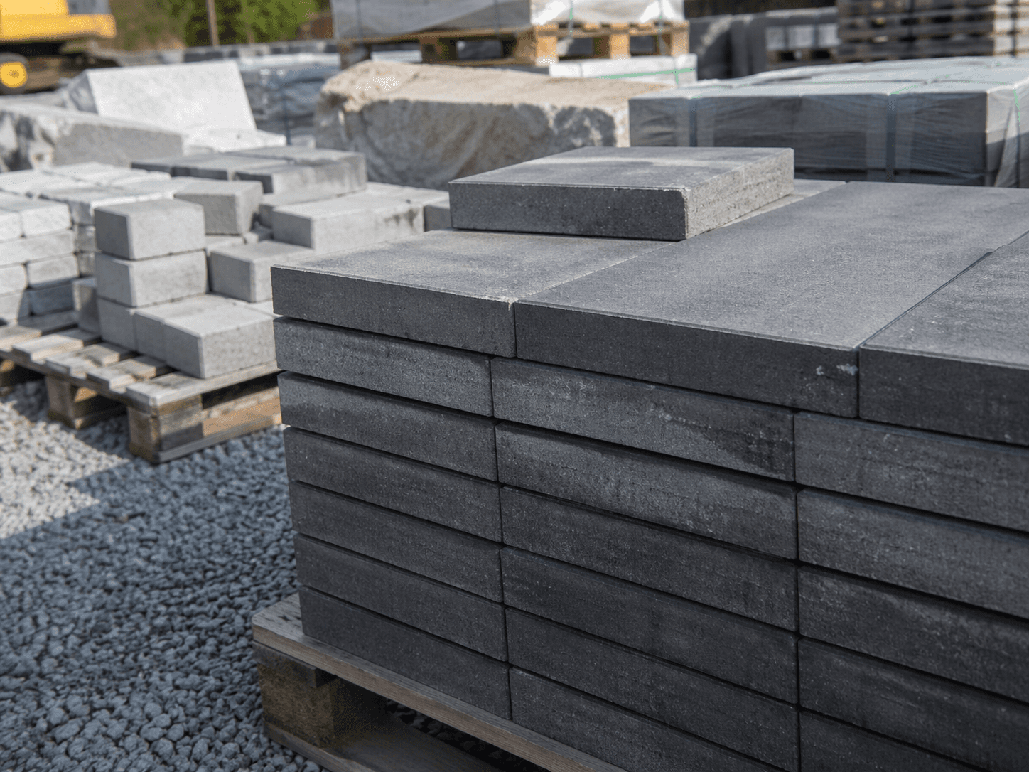 a pile of cement blocks sitting on top of a sidewalk